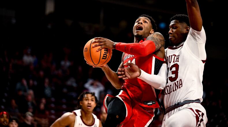 Justin Hill (middle) and the Bulldogs play LSU on Wednesday in the SEC Tournament. (Photo by Rob Davis / UGA Athletics)
