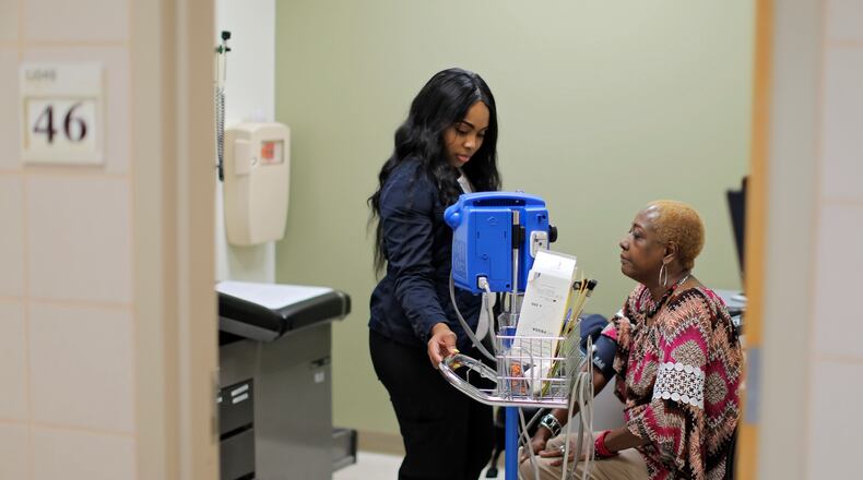 7/28/17 - Atlanta, GA - Lynette McClain, from Atlanta, has her vital signs checked by Marie Carter at a Grady Primary Care Clinic. She is a Medicare patient and opposed to repealing or replacing "Obamacare". The signature election issue of Republicans for the last seven years, repealing Obamacare, has thus far failed. BOB ANDRES /BANDRES@AJC.COM
