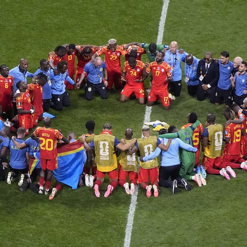 Congo players and staff pray after the World Cup Group K soccer match between DR Congo and Uzbekistan in Atlanta, Saturday, June 27, 2026. (AP Photo/Mike Stewart)