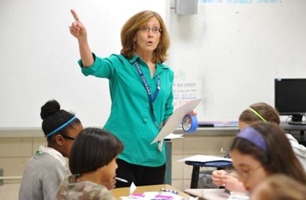 May 15, 2014 Atlanta - Paula Moore, math teacher, teaches her classs at Henderson Middle School in Atlanta on Thursday, May 15, 2014. In 2006, Georgia education officials touted the growing numbers of minority and disadvantaged students flowing into gifted classes. But an analysis by The Atlanta Journal-Constitution shows black students still lag significantly behind their white counterparts in gifted programs. And the gap is wide when it comes to poor students. HYOSUB SHIN / HSHIN@AJC.COM Georgia plans to assess teachers based on student growth, but are we clear on what growth really means? HYOSUB SHIN / HSHIN@AJC.COM