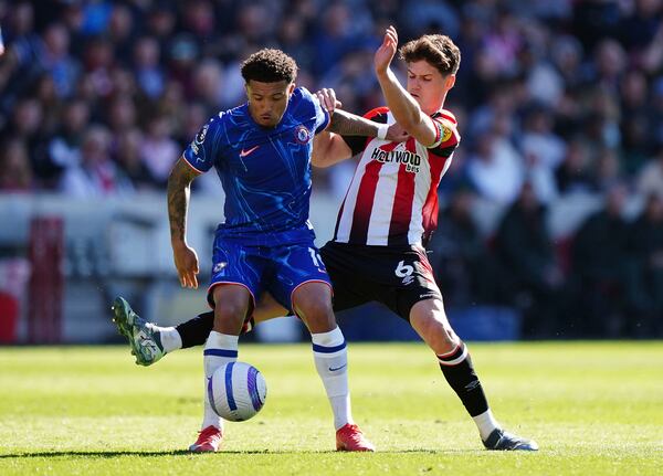 Brentford's Christian Norgaard, left and Chelsea's Jadon Sancho vie for the ball, during the English Premier League soccer match between Brentford and Chelsea, at the Gtech Community Stadium, in London, Sunday April 6, 2025. (Zac Goodwin/PA via AP)