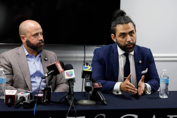 Giovanni Diaz (left) and Zacharias Gaeta, representing Mario Guevara, speak during a news conference Tuesday, June 17, 2025, in Smyrna. (Miguel Martinez/AJC)