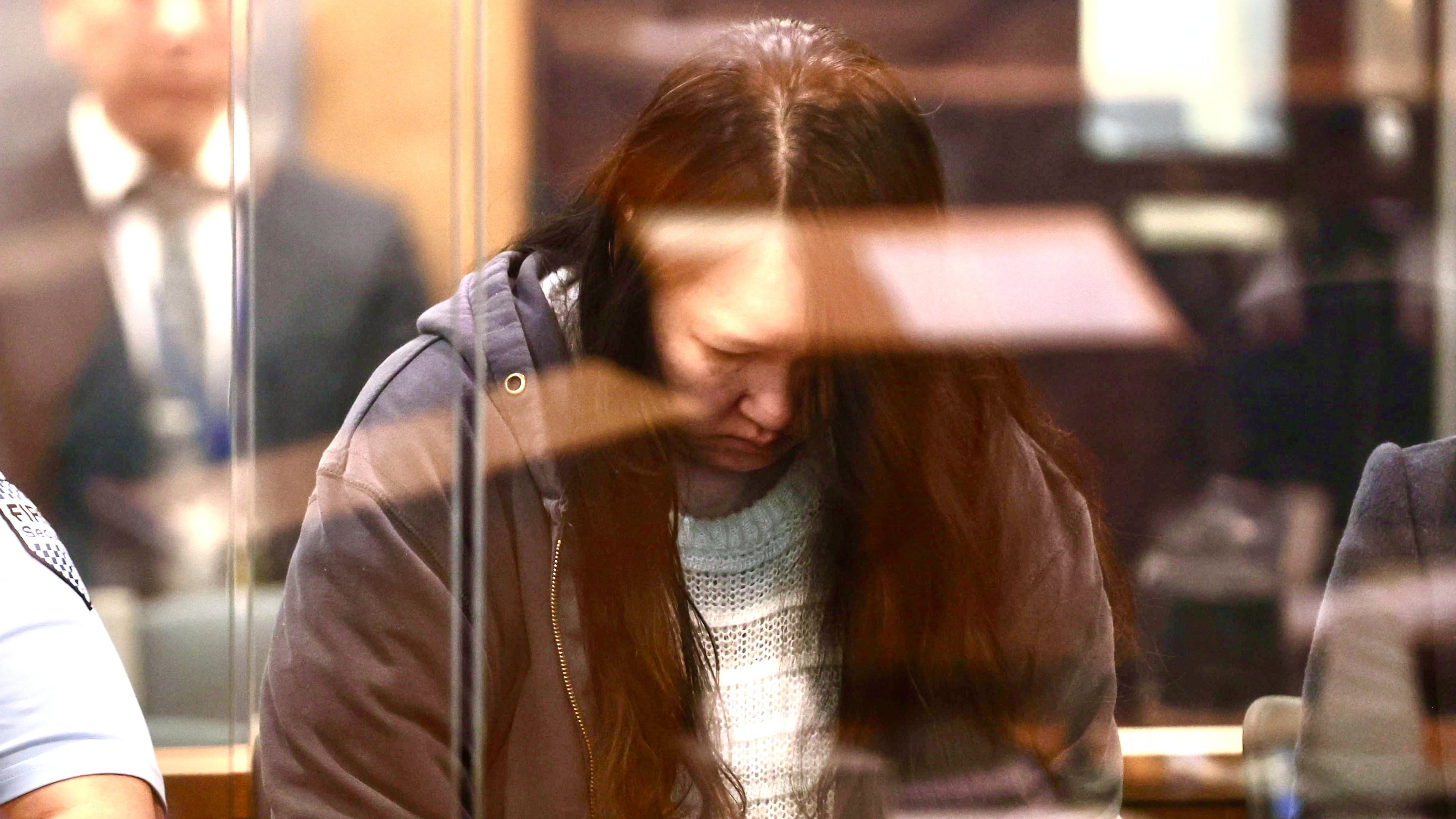 FILE - Hakyung Lee stands in the dock at the High Court in Auckland, New Zealand, Monday, Sept. 8, 2025. (Lawrence Smith/Stuff Pool Photo via AP, File)