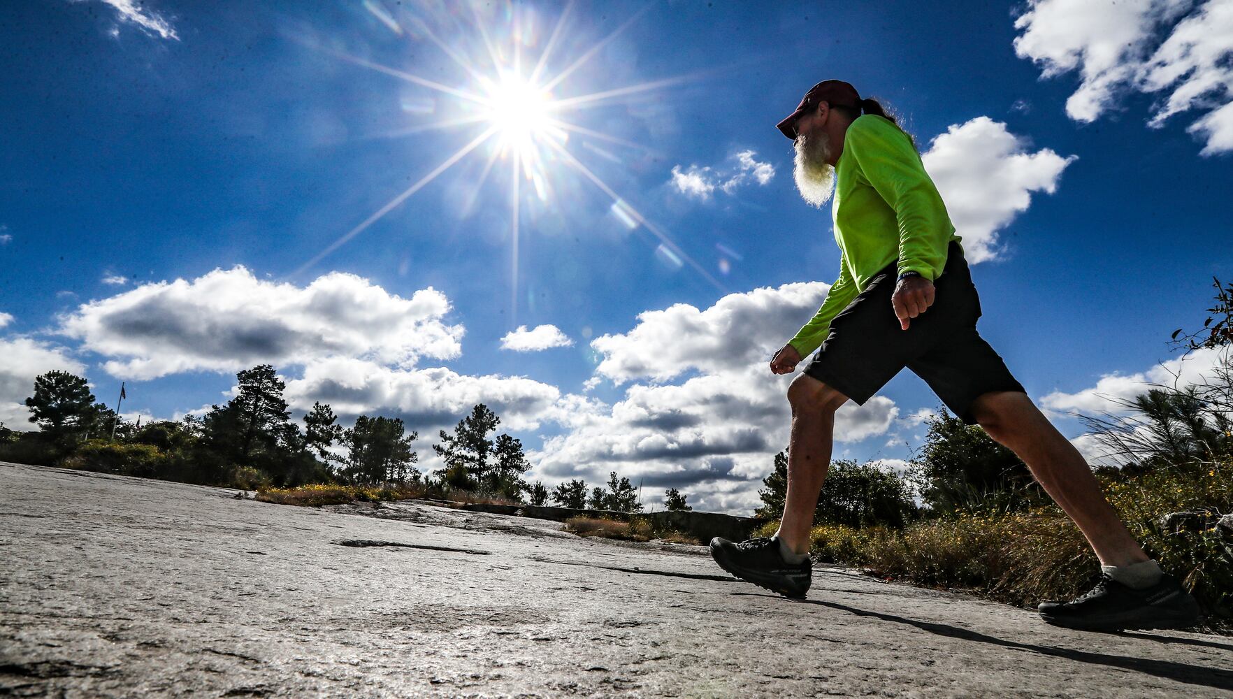 On a chilly morning, Keith Howard from North Adams, Massachusetts, begins his ascent to the top of Stone Mountain at Stone Mountain Park on Monday, Oct. 16, 2023, along the 1-mile trek that reaches 1,686 feet above sea level. Howard was in town visiting a friend and loves to come to the park. (John Spink / John.Spink@ajc.com) 

