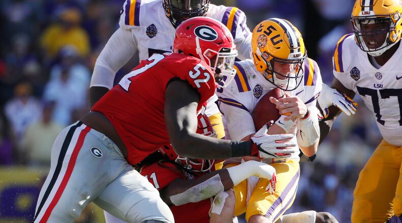 Georgia defensive lineman Tyler Clark (52) sacks LSU Tigers quarterback Joe Burrow.