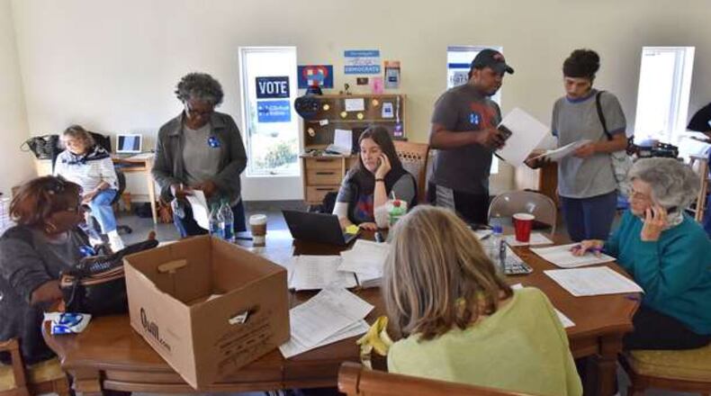 Volunteers call voters for their campaign at Georgia Democratic Party’s DeKalb Field Office on Saturday, November 5, 2016. HYOSUB SHIN / HSHIN@AJC.COM
