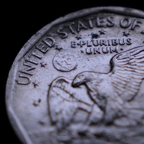 The Latin phrase "E Pluribus Unum" is seen on a one dollar coin, Monday, April 13, 2026, in Portland, Maine.(AP Photo/Robert F. Bukaty)