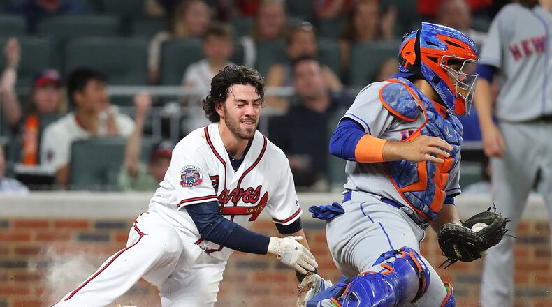 Dansby Swanson scores on a triple by Emilio Bonifacio on Wednesday. Swanson had three walks and scored twice in that game against the Mets (Curtis Compton/ccompton@ajc.com)