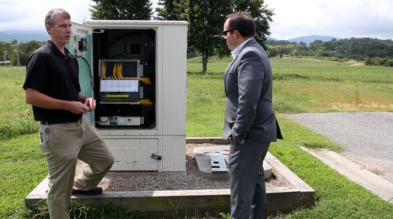 8/22/18 - Young Harris - Daniel Frizzell, the director of engineering at Blue Ridge Mountain EMC, left, explains the way in which Blue Ridge Mountain EMC provides internet services to rural areas with Jeremy Nelms, manager of Blue Ridge Mountain EMC, listening on Wednesday, August 22. Blue Ridge Mountain EMC is based out of Young Harris, Georgia. Jenna Eason / Jenna.Eason@coxinc.com