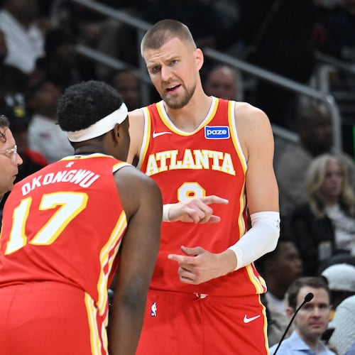 Atlanta Hawks center Kristaps Porziņģis will miss the team's game against the Orlando Magic on Friday with what the injury report called 'flu-like symptoms'. (Hyosub Shin/AJC)