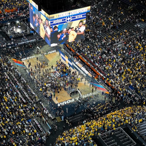 Michigan celebrates after defeating UConn in the NCAA college basketball tournament national championship game at the Final Four, Monday, April 6, 2026, in Indianapolis. (AP Photo/AJ Mast)