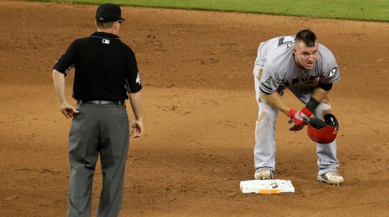 Los Angeles Angels' Mike Trout stands on second after stealing the base during the fifth inning of an interleague baseball game against the Miami Marlins, Sunday, May 28, 2017, in Miami.