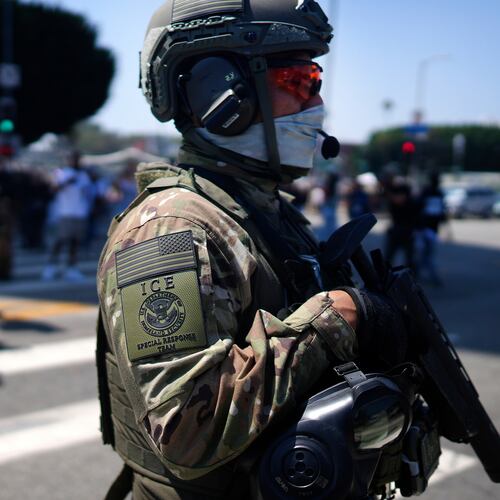 FILE - An ICE Special Response Team member stands guard outside the Metropolitan Detention Center, while protesters gather outside to denounce the ICE, U.S. Immigration and Customs Enforcement, operations, June 10, 2025, in downtown Los Angeles. (AP Photo/Eric Thayer, File)