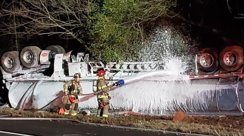 An overturned gas tanker shut down I-985 North in Hall County on Thursday.