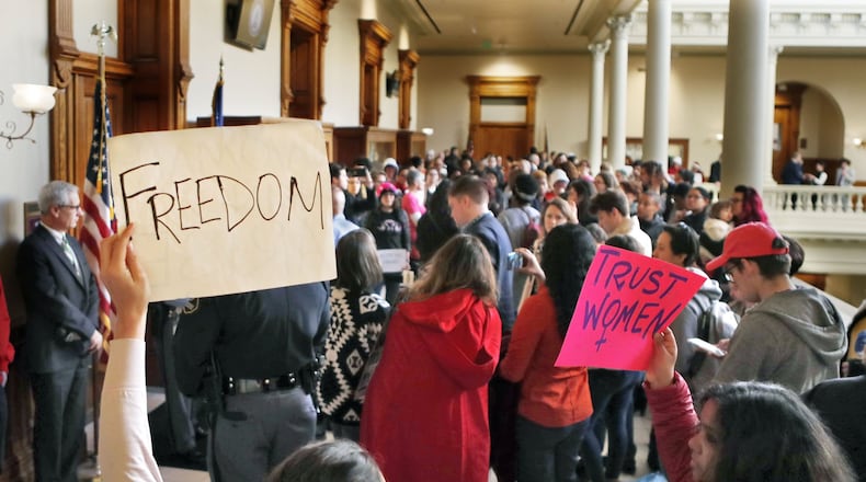 Protesters opposing the anti-abortion “heartbeat bill” clogged the hall outside a committee room Monday, at times chanting loudly, after a Georgia Senate panel approved an amended version of the measure early Monday. The legislation, House Bill 481, could be debated on the Senate floor by the end of the week. Bob Andres / bandres@ajc.com