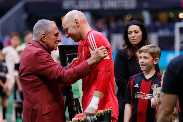 Atlanta United owner Arthur Blank embraces goalkeeper Brad Guzan as he prepares to play his last game at Mercedes-Benz Stadium on October 18, 2025, in Atlanta. Brad Guzan retires from professional soccer, hanging up his gloves after a career that has spanned over two decades.
(Miguel Martinez/AJC)