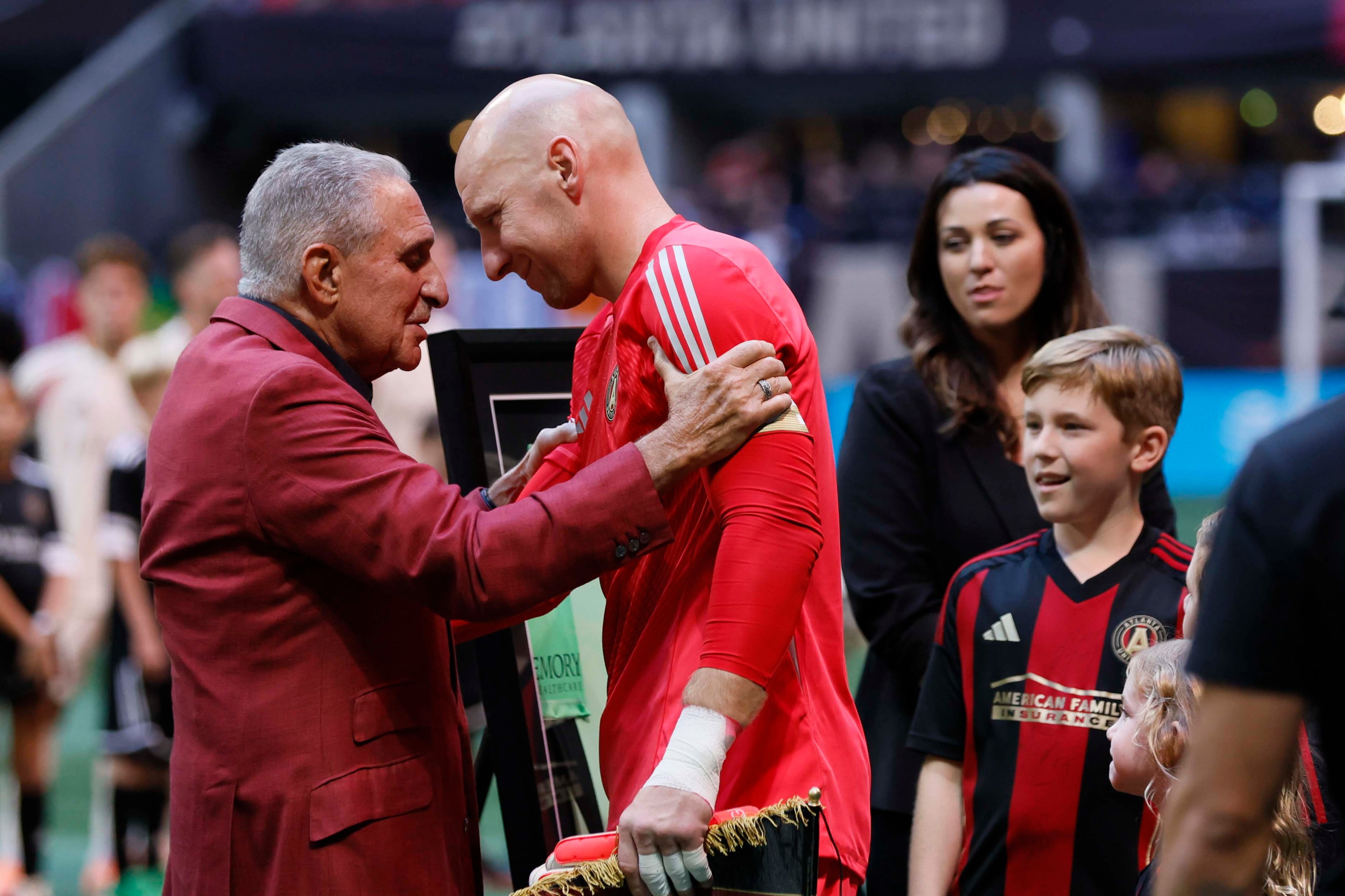 Atlanta United owner Arthur Blank embraces goalkeeper Brad Guzan as he prepares to play his last game at Mercedes-Benz Stadium on October 18, 2025, in Atlanta, GA. Brad Guzan retires from professional soccer, hanging up his gloves after a career that has spanned over two decades.
(Miguel Martinez/ AJC)