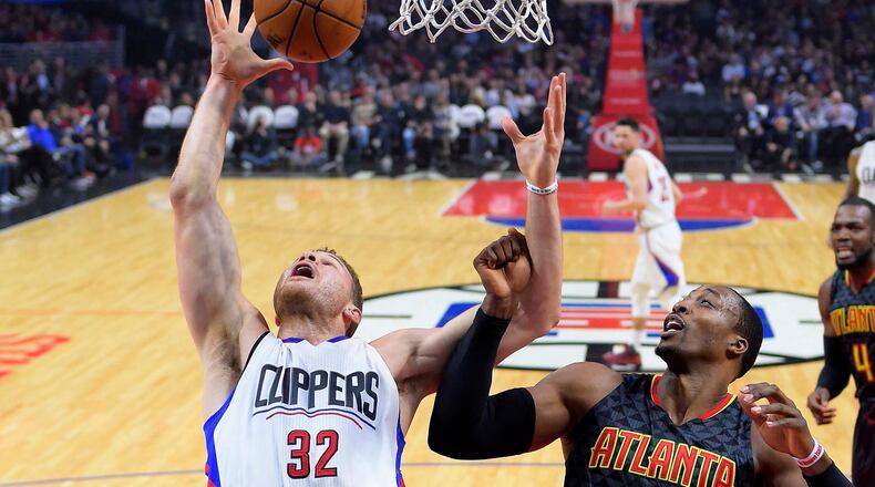 Los Angeles Clippers forward Blake Griffin, left, and Atlanta Hawks center Dwight Howard reach for a rebound during the first half of an NBA basketball game, Wednesday, Feb. 15, 2017, in Los Angeles. (AP Photo/Mark J. Terrill)