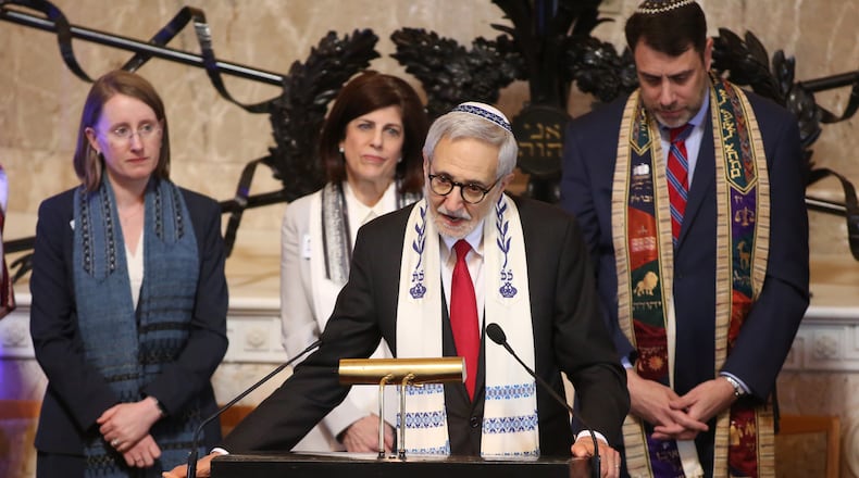 Rabbi Alvin Sugarman speaks during a 2018 prayer vigil at The Temple for the Pittsburgh synagogue shooting. Sugarman, who died this month, was a longtime rabbi at The Temple and was a seminal organizer in Atlanta of cross-faith learning and good works. (Jason Getz/AJC 2018)