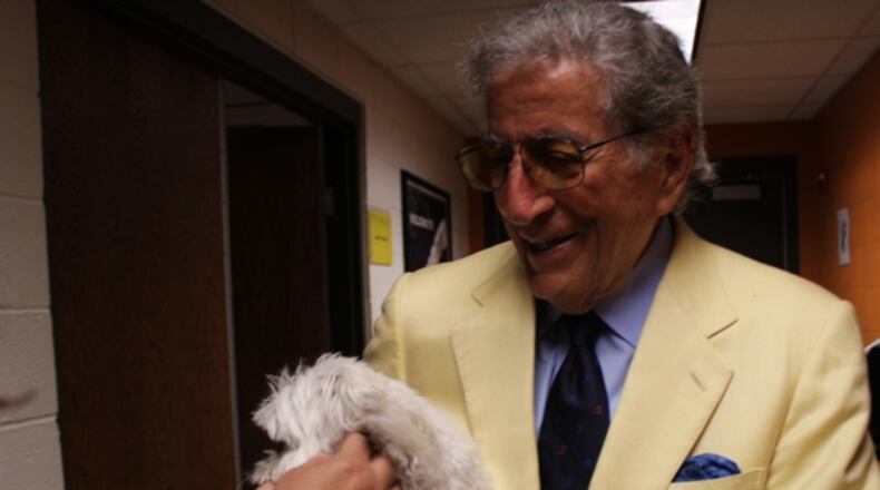 After the concert, Tony Bennett introduces his beloved dog, Happy, to fans (and my cousin Lorraine's arm). Photo: Melissa Ruggieri/AJC