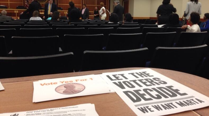 Pro-expansion handbills at a recent Clayton commission meeting. ANDRIA SIMMONS / andria.simmons@ajc.com