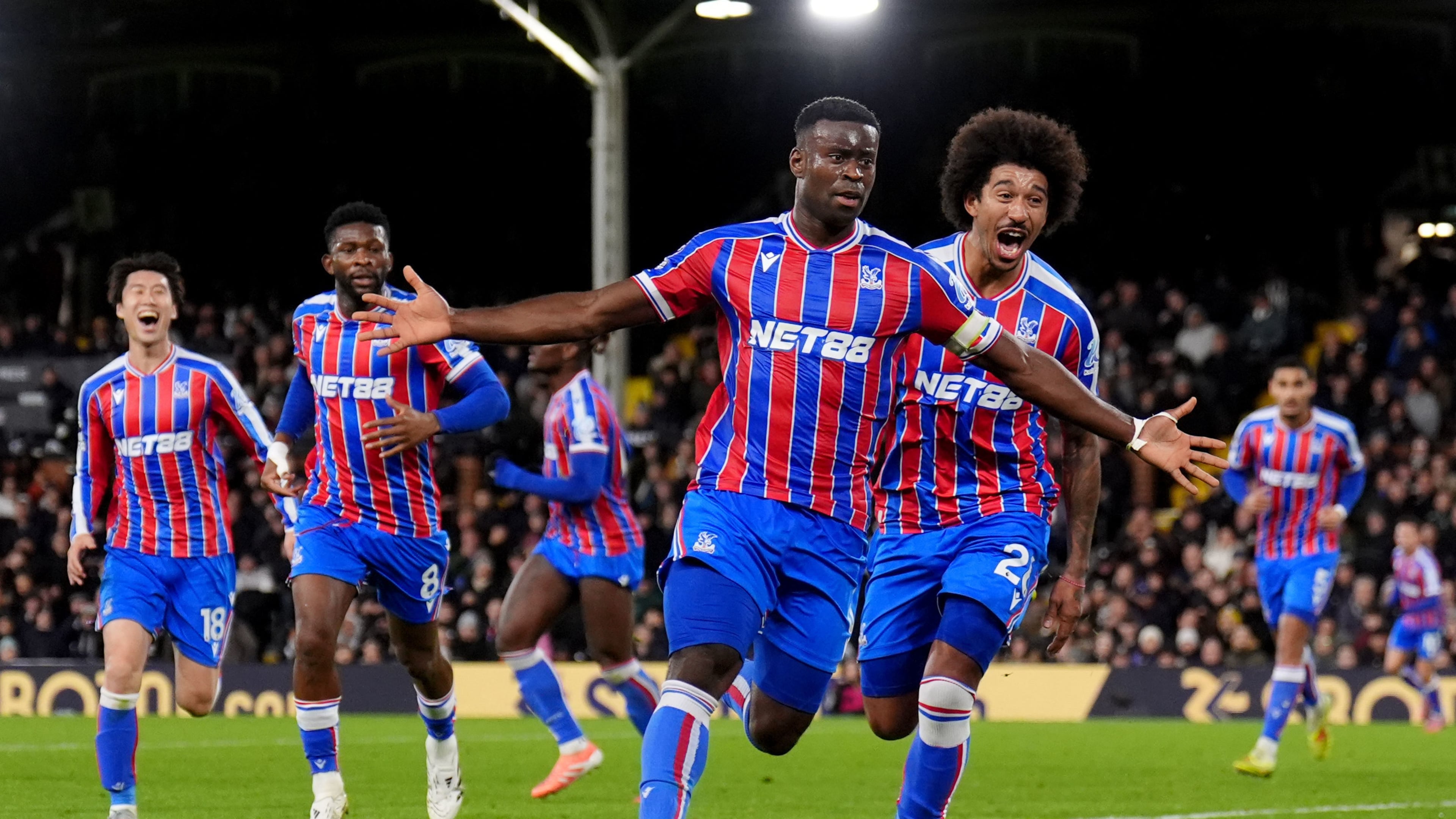 Crystal Palace's Marc Guehi celebrates after scoring his sides second goal during the English Premier League soccer match between Fulham and Crystal Palace, in London, Sunday, Dec. 7, 2025. (John Walton/PA via AP)