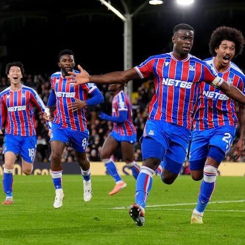 Crystal Palace's Marc Guehi celebrates after scoring his sides second goal during the English Premier League soccer match between Fulham and Crystal Palace, in London, Sunday, Dec. 7, 2025. (John Walton/PA via AP)