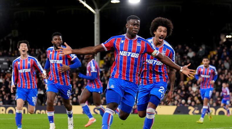 Crystal Palace's Marc Guehi celebrates after scoring his sides second goal during the English Premier League soccer match between Fulham and Crystal Palace, in London, Sunday, Dec. 7, 2025. (John Walton/PA via AP)