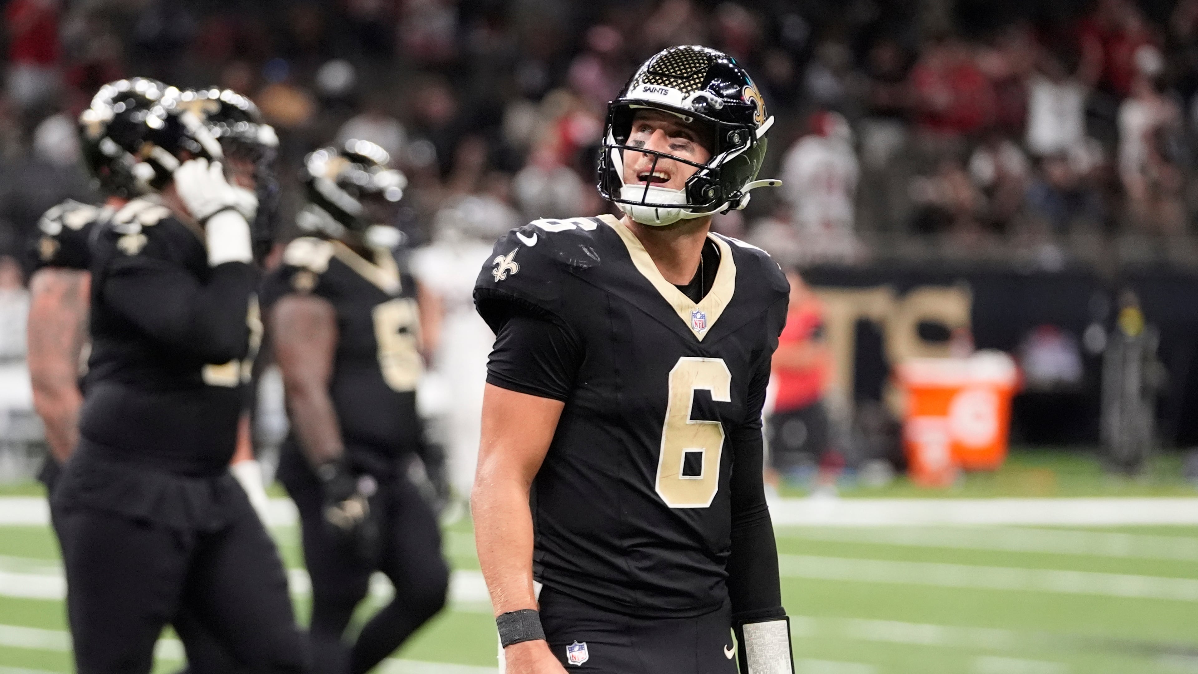 New Orleans Saints quarterback Tyler Shough (6) walks off the field after throwing an interception against the Atlanta Falcons in the second half of an NFL football game, Sunday, Nov. 23, 2025, in New Orleans. (AP Photo/Gerald Herbert)