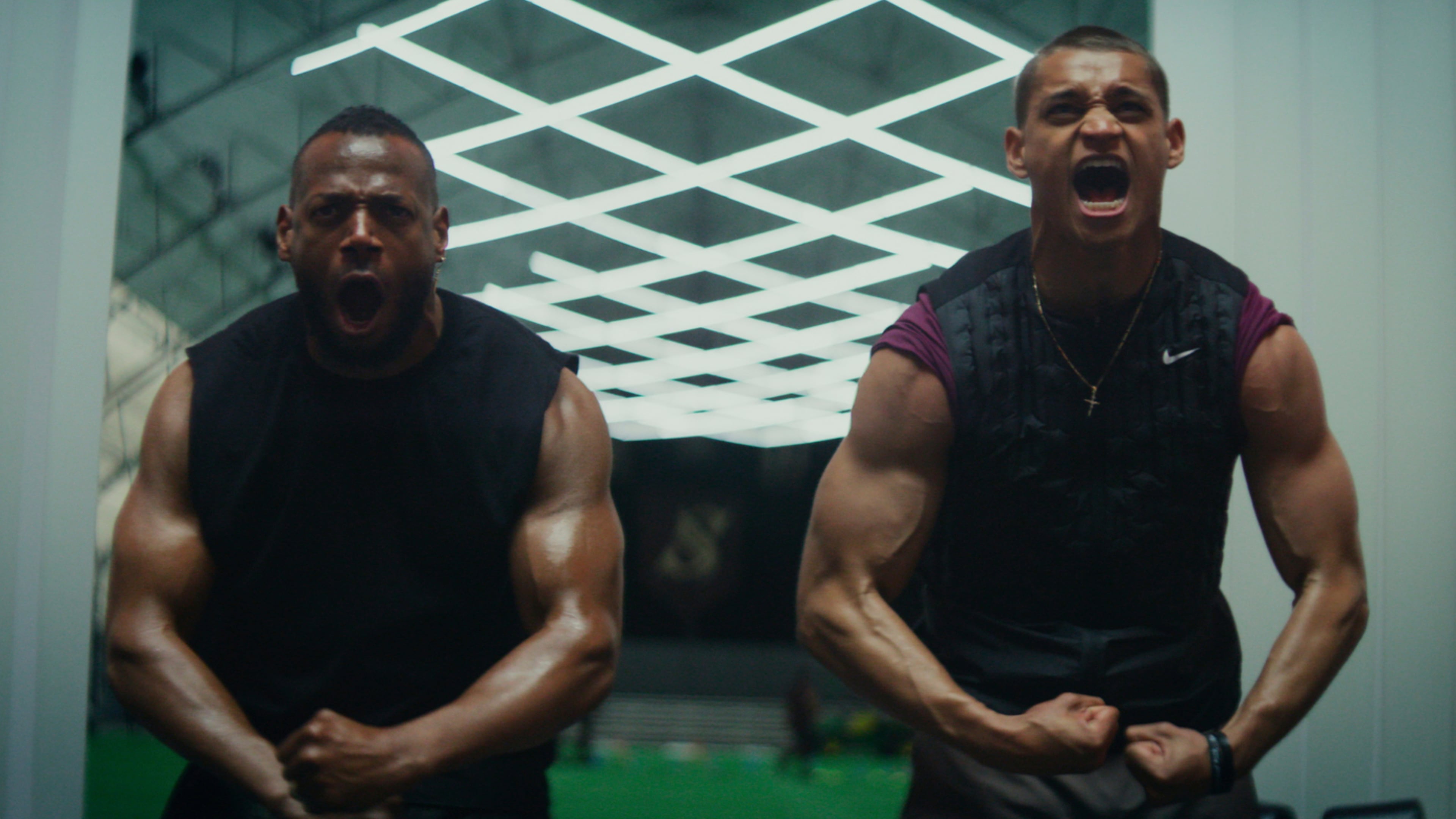 This image released by Universal Pictures shows Marlon Wayans, left, and Tyriq Withers in a scene from "Him." (Universal Pictures via AP)