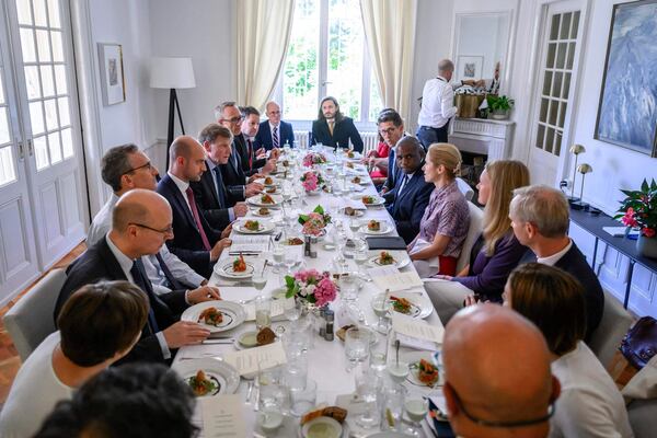 France's Minister for Europe and Foreign Affairs Jean-Noel Barrot, 4th left, Britain's Foreign Secretary David Lammy, 6th right, Germany's Foreign Minister Johann Wadephul, 5th left, and European Union High Representative for Foreign Affairs and Security Policy, Kaja Kallas, 5th right, attend a work lunch at the offices of the honorary Consul of the Federal Republic of Germany in Geneva, Friday, June 20, 2025. (Fabrice Coffrini/Keystone via AP)