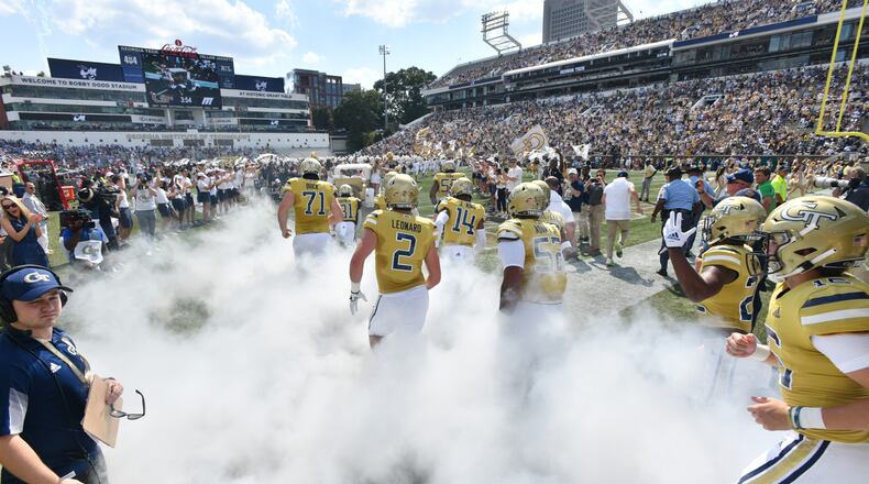 Georgia Tech's Ramblin' Wreck leads the band, cheerleaders, Buzz, players, and coaches before the start of the Georgia Tech home game against Ole Miss in an NCAA college football game at Georgia Tech's Bobby Dodd Stadium in Atlanta on Saturday, September 17, 2022. (Hyosub Shin / Hyosub.Shin@ajc.com)