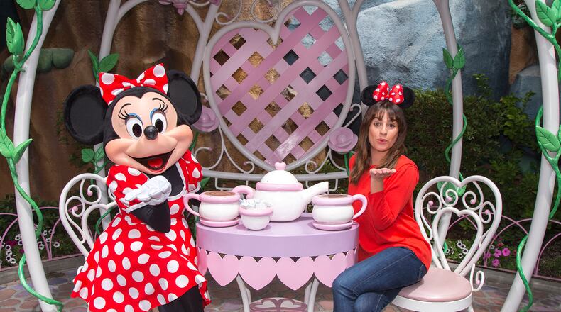 ANAHEIM, CA - MAY 14: In this handout photo provided by Disney Parks, actress Lea Michele dons Minnie ears on a visit to Minnie Mouse's house in Mickey's Toontown May 14, 2015 at Disneyland park in Anaheim, California. (Photo by Paul Hiffmeyer/Disneyland Parks via Getty Images)