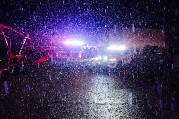 Rain falls as police vehicles block a road in Ada, Okla. Saturday, April 19, 2025. (Richard R. Barron/The Ada News via AP)
