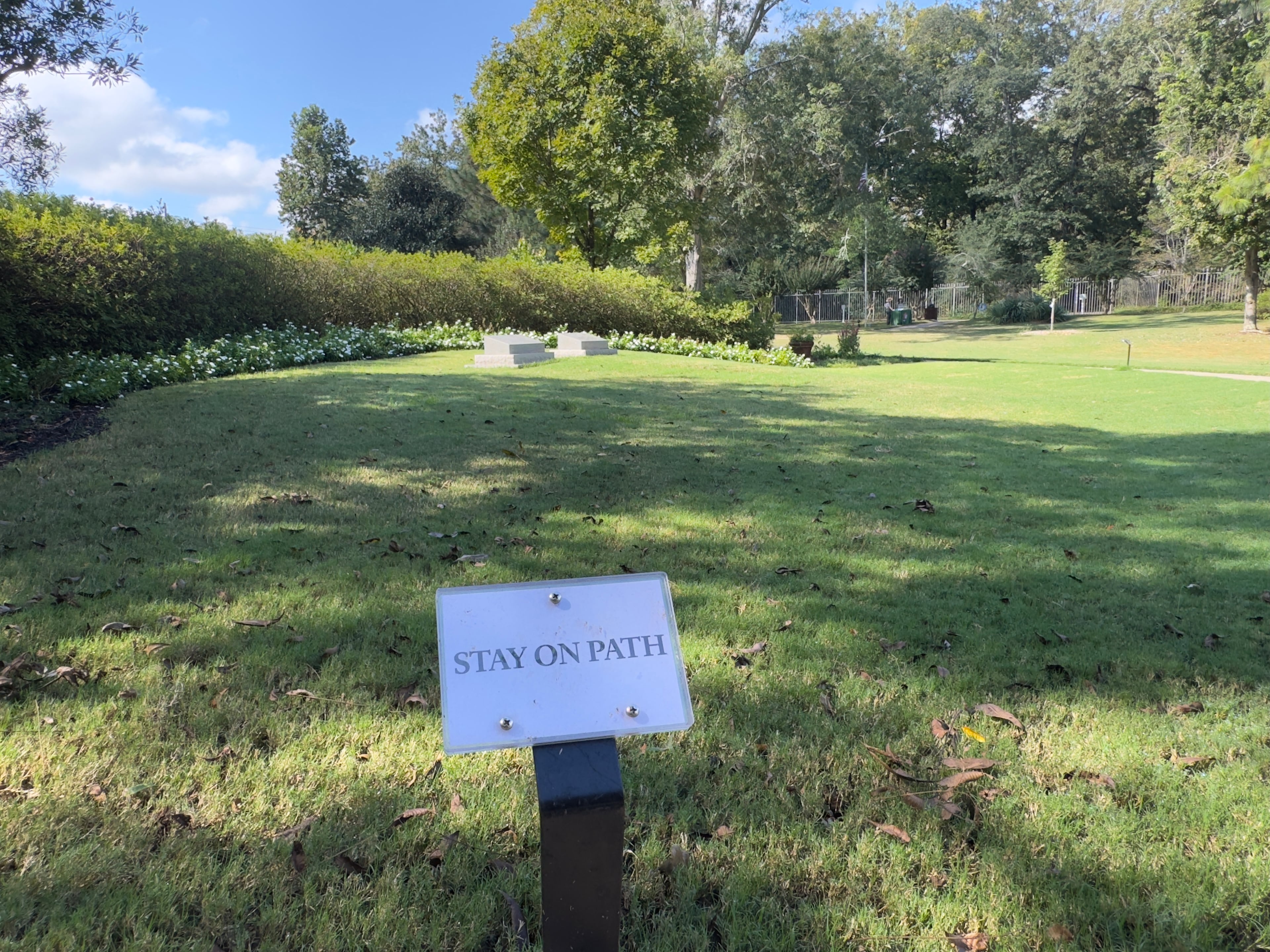Visitors at Carter Gardens, the burial site for former President Jimmy Carter and former First Lady Rosalynn Carter, are reminded to keep off the grass near the graves. (Joe Kovac Jr./AJC)