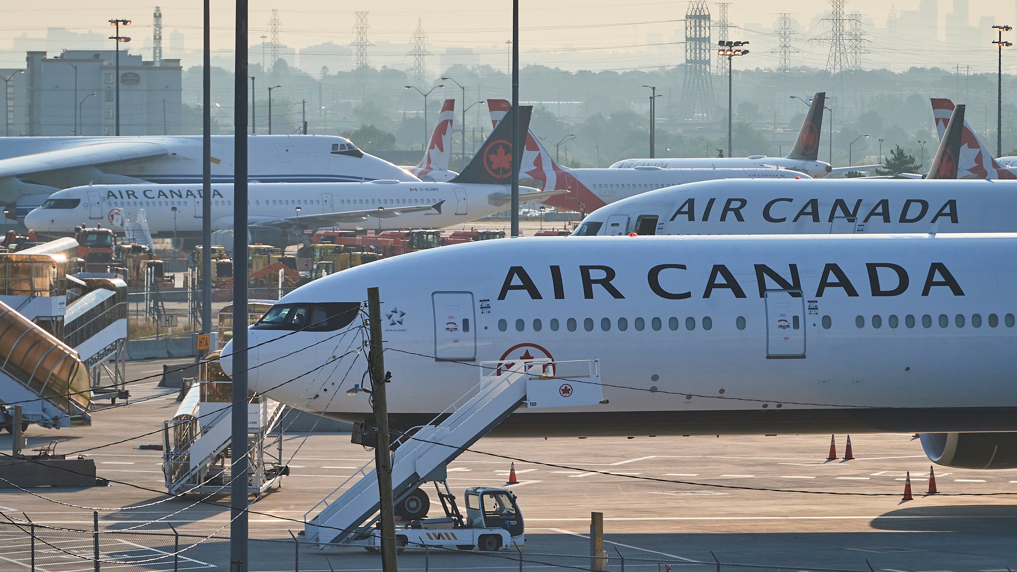Air Canada planes sit on the runway at Pearson International Airport as flight attendants go on strike in Toronto on Saturday, Aug. 16, 2025. Air Canada operates around 700 flights per day. (Sammy Kogan/The Canadian Press via AP)