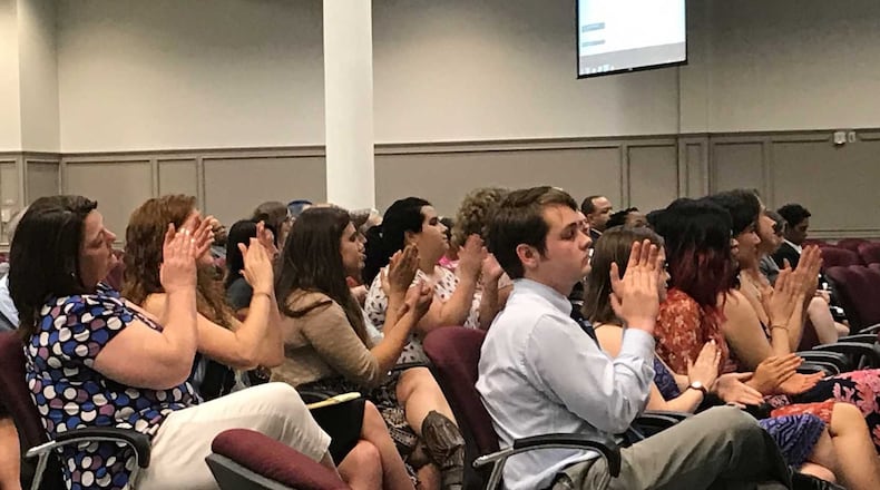 Audience members applaud a speaker who raised concerns about some of the sex education lessons taught by the Pregnancy Resource Center of Gwinnett during the June 15, 2017 Gwinnett County school board meeting in Suwanee. ERIC STIRGUS / ESTIRGUS@AJC.COM
