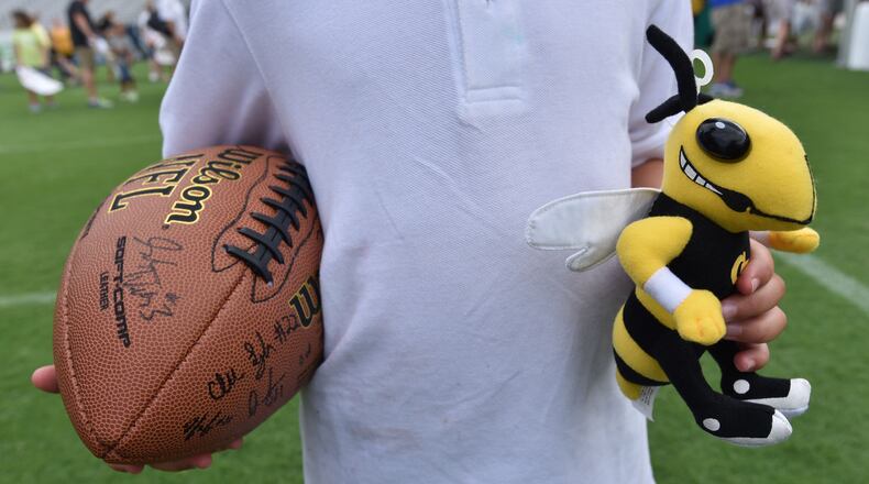 Max Campbell, 6, holds his signed football as he lines up for more autographs during 2016 Football Fan Day at Bobby Dodd Stadium on Saturday, August 6, 2016. HYOSUB SHIN / HSHIN@AJC.COM