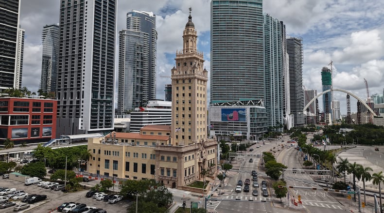 The Freedom Tower is seen in downtown Miami on Friday, Aug. 8, 2025. (AP Photo/Daniel Kozin)