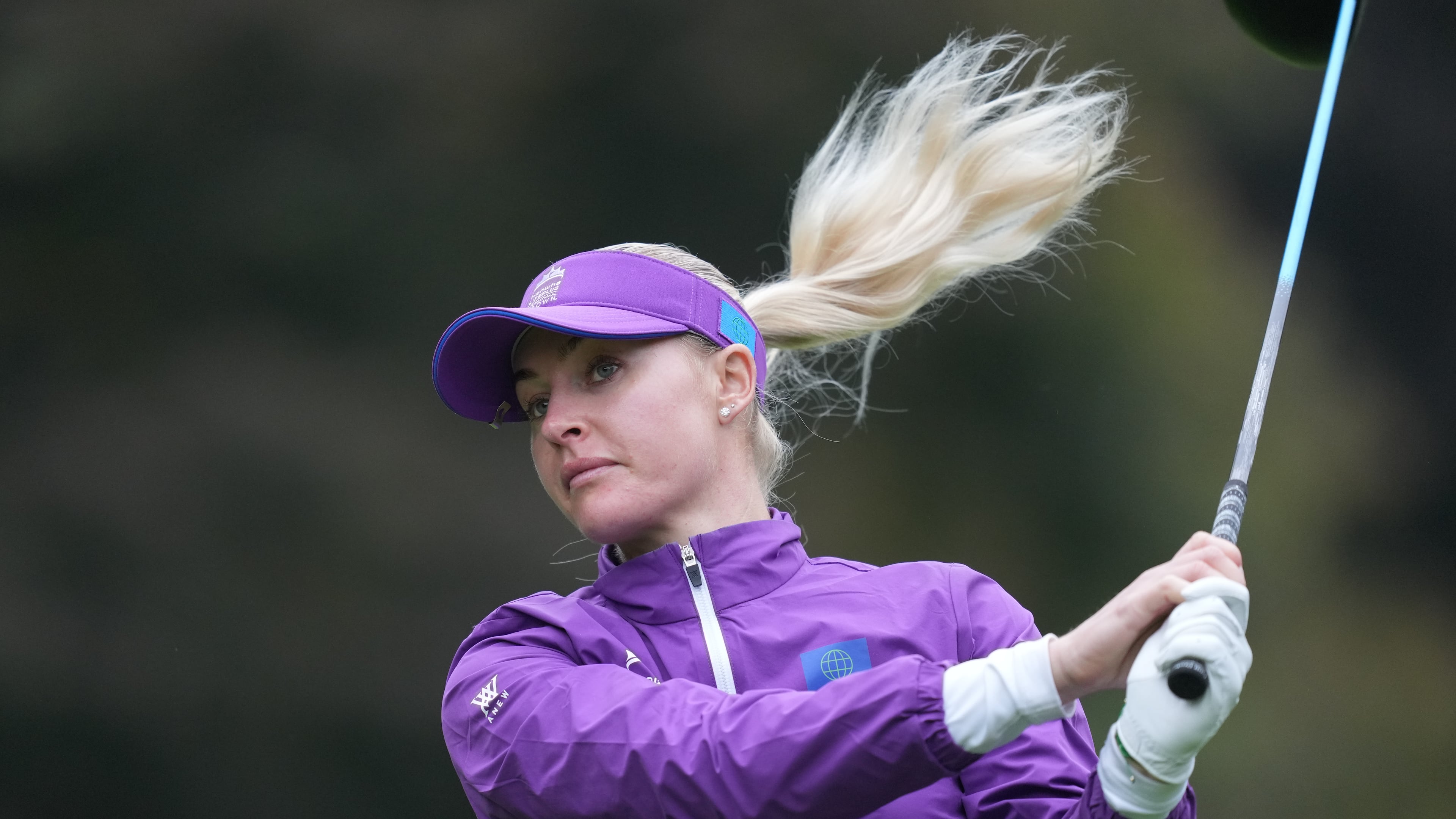Charley Hull, of World team, tees off on the ninth hole during the semifinal against Australia team for the LPGA International Crown golf tournament at the New Korea Country Club in Goyang, South Korea, Sunday, Oct. 26, 2025. (AP Photo/Lee Jin-man)