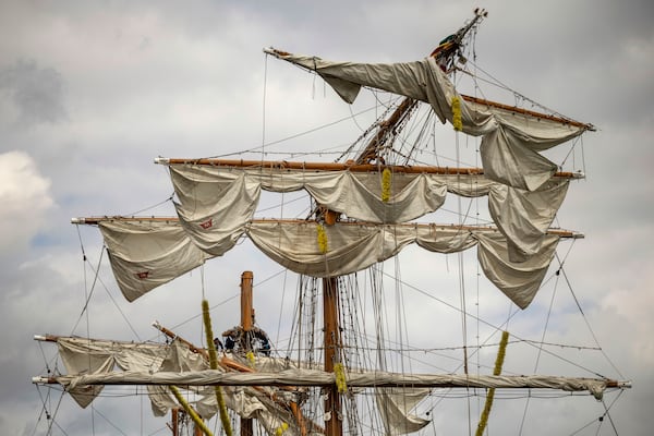 Crew members work on the mast of the Cuauhtémoc, a masted Mexican Navy training ship, at Pier 35 after it collided with the Brooklyn Bridge, Sunday, May 18, 2025, in New York. (AP Photo/Yuki Iwamura)