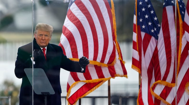 President Donald Trump greets the crowd at the "Stop the Steal" rally in Washingotn on Jan. 6, 2021, before some in the crowd staged a riot at the U.S. Capitol. The State Bar of Georgia is investigating two Republicans who served as fake Trump electors in December 2020. Tasos Katopodis/Getty Images/TNS)