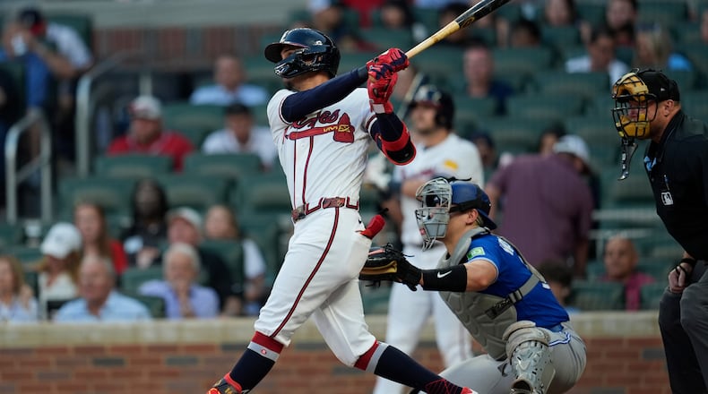Atlanta Braves' Mauricio Dubón hits a three-run homer in the third inning of a baseball game against the Toronto Blue Jays, Wednesday, June 3, 2026, in Atlanta. (AP Photo/Mike Stewart)