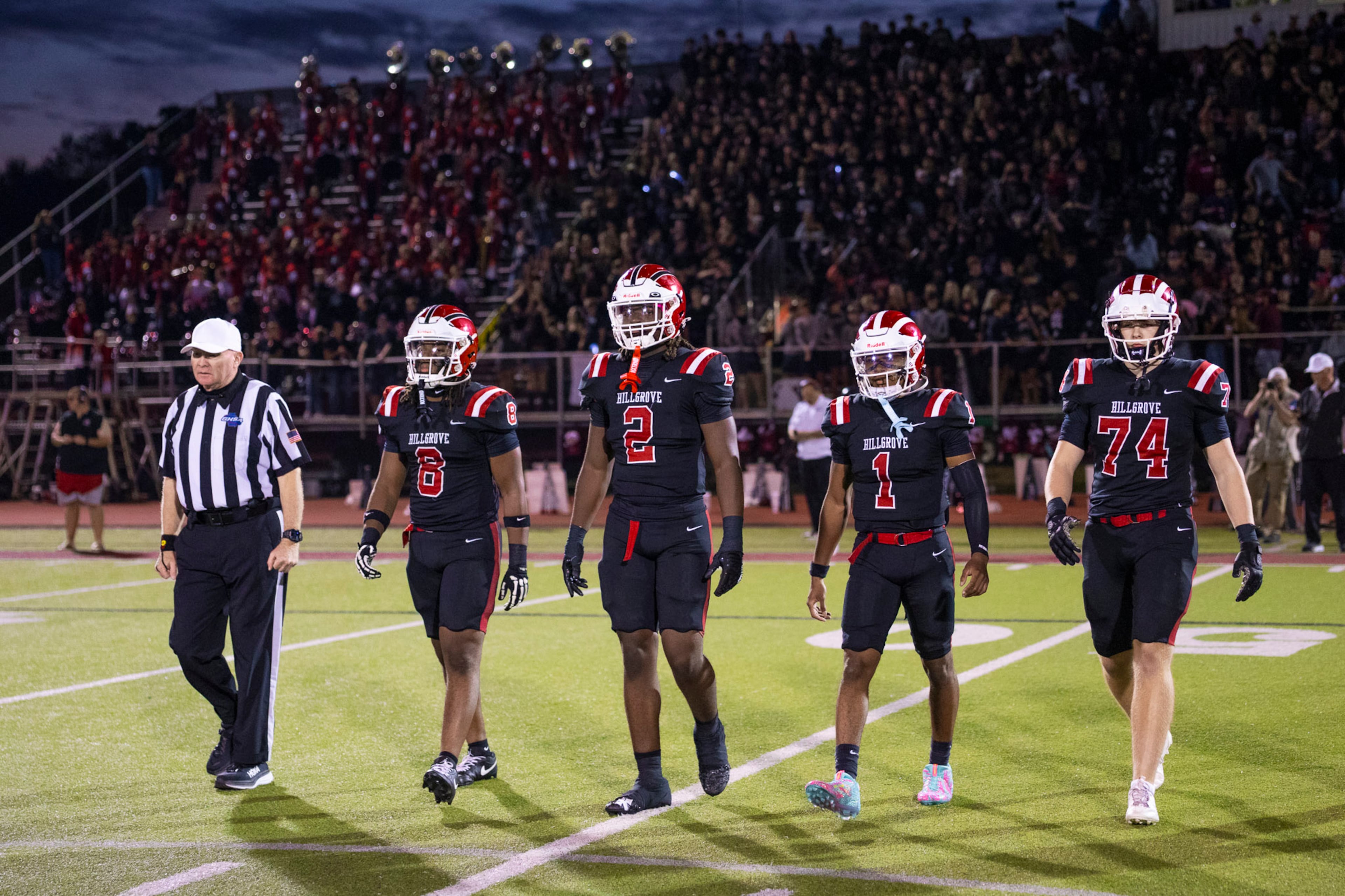 Hillgrove captains go to the center for the coin toss against McEachern at Cobb Energy Hillgrove Stadium in Powder Springs, GA on Friday, October 17th, 2025. (Oscar Guevara Saenz for the AJC)