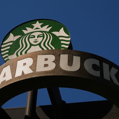 FILE - A Starbucks sign is seen outside the coffee company's global corporate headquarters, May 11, 2026, in Seattle. (AP Photo/Lindsey Wasson, File)