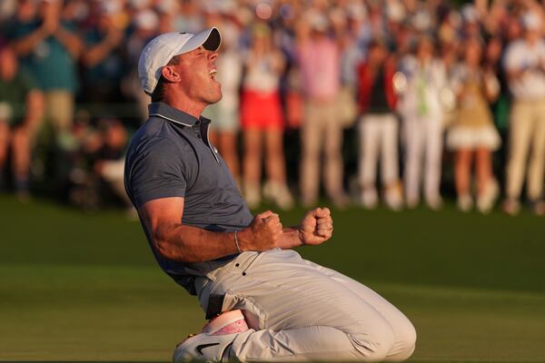 Rory McIlroy, of Northern Ireland, celebrates winning in a playoff against Justin Rose, of England, after the final round the Masters golf tournament, Sunday, April 13, 2025, in Augusta, Ga. (AP Photo/Matt Slocum)