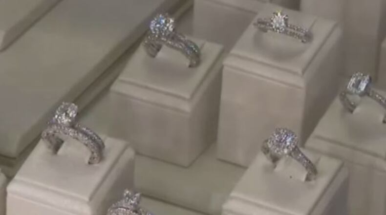 A couple is accused in an alleged $1.4 million diamond swindle. (Credit: Channel 2 Action News)
