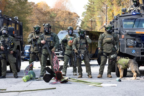 Police stand by after a clash with protestors demonstrating against Atlanta’s public training safety center in Atlanta on Monday, November 13, 2023. (Arvin Temkar / arvin.temkar@ajc.com)