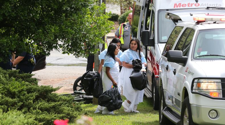 Workers reported not being able to breathe while sorting materials that were dropped off. JOHN SPINK / JSPINK@AJC.COM