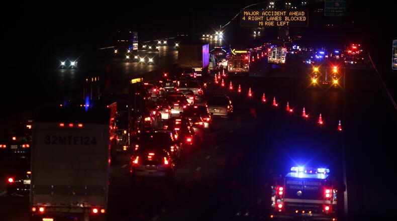 A fatal wreck blocked multiple lanes of I-285 in Dunwoody late Tuesday night. (Ben Gray / bgray@ajc.com)